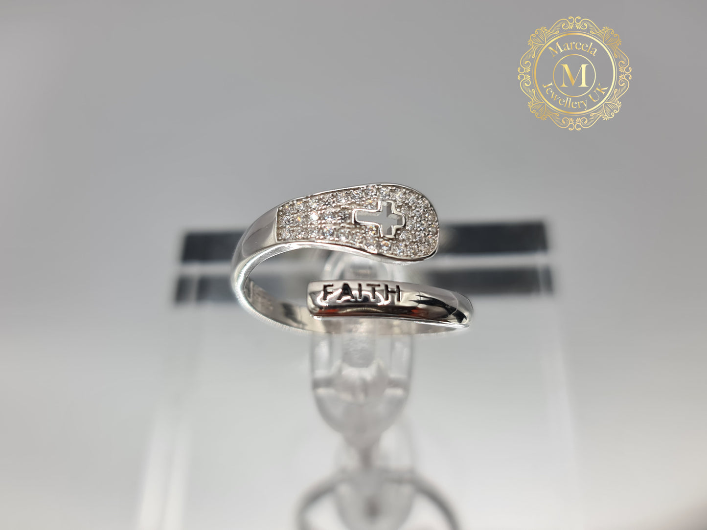 Brand New "Faith and Cross " ring adorned with cubic zirconia stones in Sterling Silver